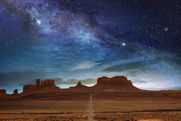 Starry sky over desert monuments
