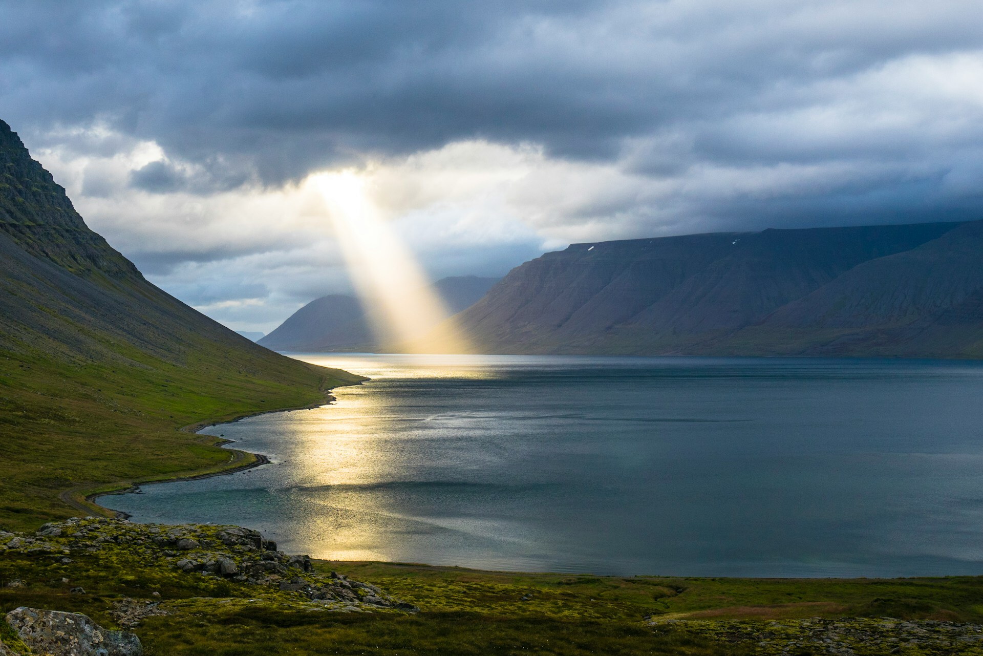 Light beam over a fjord
